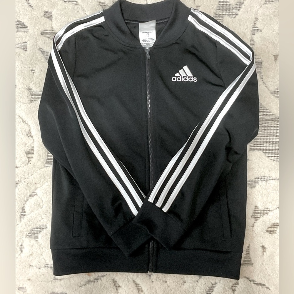 ADIDAS child’s track top.
